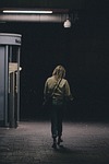 woman walking street alone girl female dark night stock photo