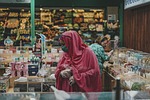 woman face mask market hijab people store grocery stock photo
