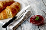 croissants jam breakfast knife butter meal food bread stock photo