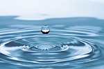 drop of water impact ripples nature surface tension stock photo