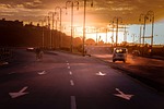 sunset roads traffic cars vehicles street lamps nature stock photo