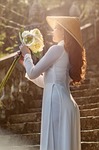 woman ao dai nature flower wallpaper fashion flowers stock photo