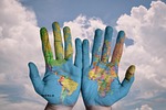 hands world map global earth globe continents palms stock photo