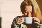 woman drinking coffee young morning break cup blonde stock photo