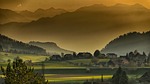 mountains village trees hills fields landscape autumn twilight stock photo