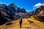 mount everest mountains trekking nepal hiker hiking backpacking stock photo