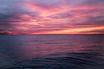 sunset sea horizon dawn sky clouds ocean nature stock photo