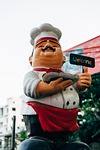 chef statue restaurant sculpture welcome figure stock photo