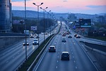 highway city cars traffic road urban twilight sunset stock photo
