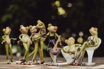 bbq party characters frog figures frogs sculptures garden stock photo