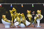 garden party sculptures frog celebration outdoors frogs stock photo