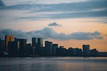 city buildings sunrise skyline water nature twilight cityscape stock photo