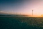 sunrise windmills pinwheels dusk sunset nature haze landscape stock photo