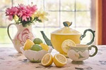 tea lemons pot teacup time afternoon drink hot stock photo
