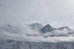 mountains nature alps clouds snow capped altitude landscape stock photo
