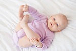 baby little child lying down loving small childhood stock photo