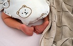 infant small child foot toes newborn barefoot cute stock photo