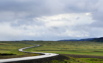 road lonely isolated highway wilderness curving wet asphalt stock photo