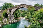 landscape roman bridge river vegetation nature darling clouds stock photo
