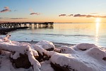 winter pier sunrise bay snow nature dock stock photo