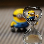 minion fun toy children hourglass cute yellow stock photo
