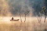 vietnam fishing fisherman fog mist nature landscape water stock photo
