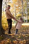 father girl care love worry children palm autumn stock photo
