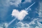 heart clouds aircraft wake cloudy weather nature shapes stock photo