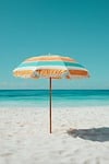 umbrella beach nature summer sand teal orange sunny stock photo
